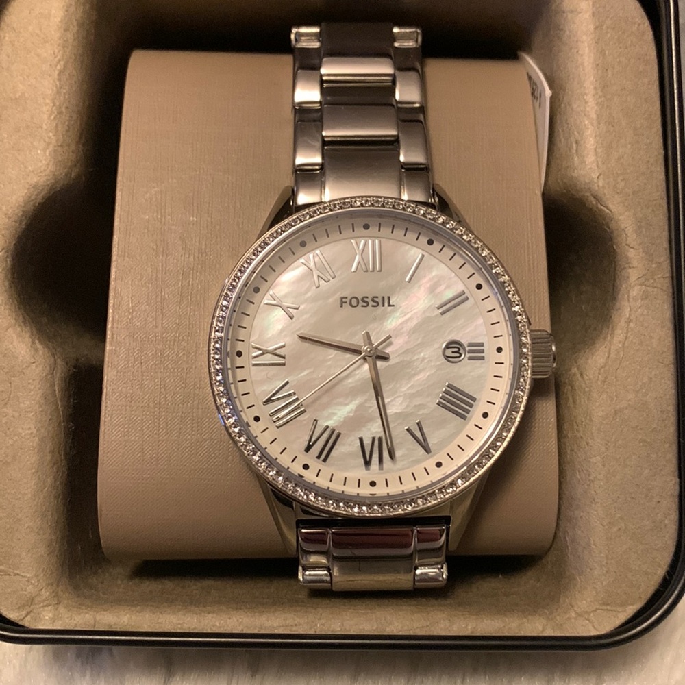 New Fossil watch. Silver with diamonds around the face. Tags still on